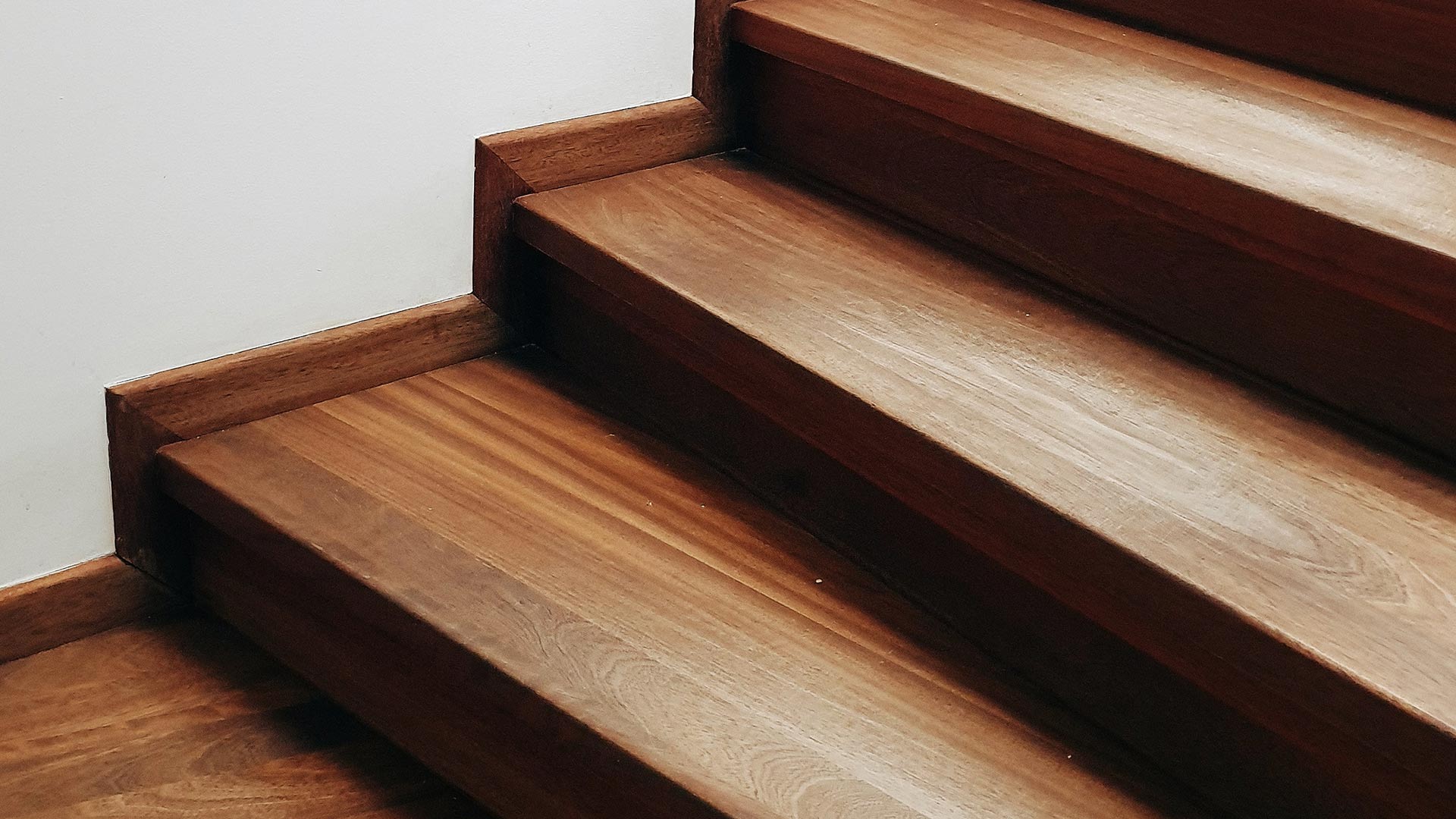 close up of a hardwood straight staircase lawndale ca