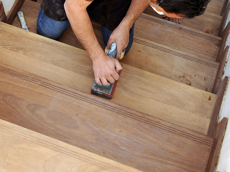 flooring contractor sanding a hardwood staircase lawndale ca